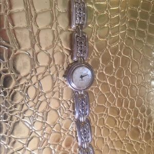 Watch silver with gold accents